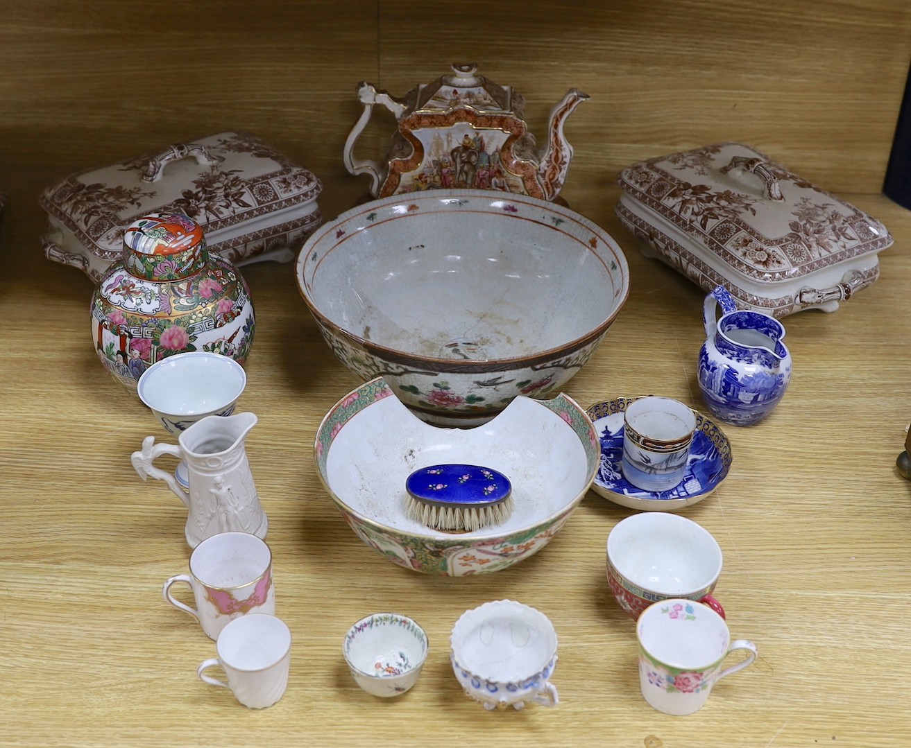 A group of mixed ceramics and an enamel brush